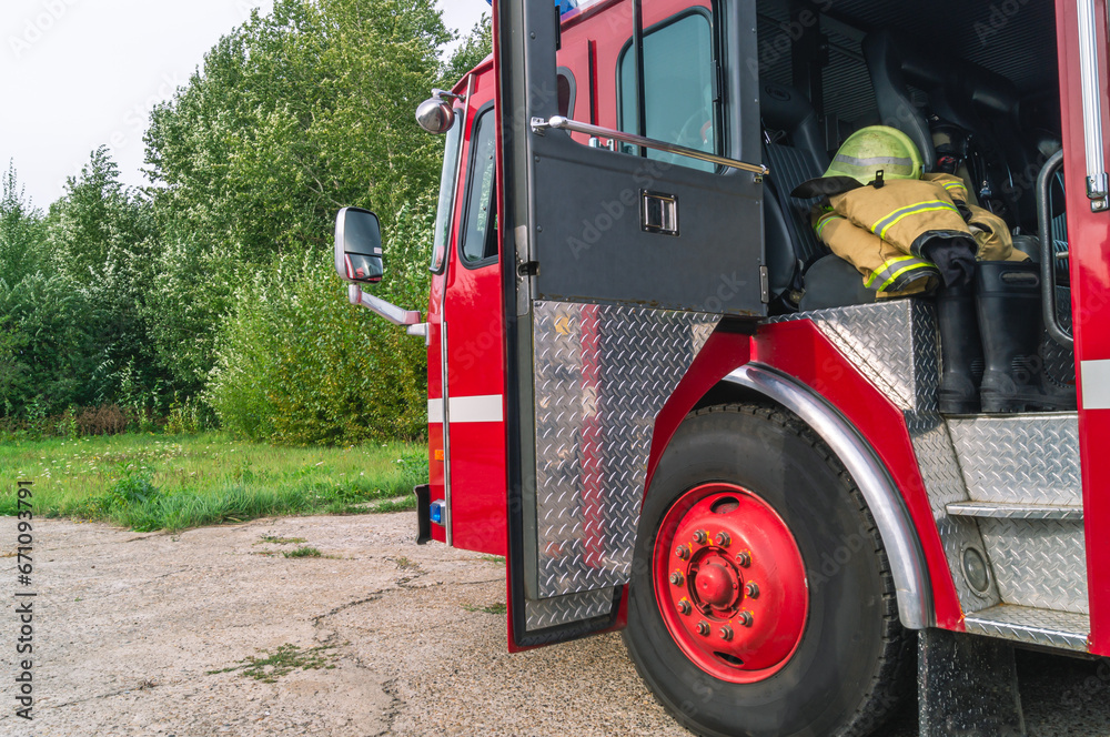 The open door of the fire truck cabin where the firefighters are
