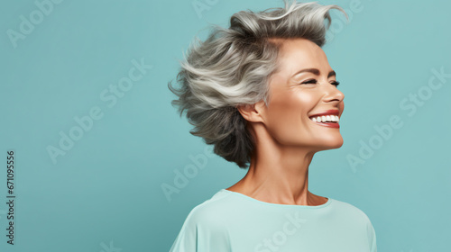 Profile side photo of mature cheerful pretty lady have fun clubber look empty space isolated over turquoise color background photo