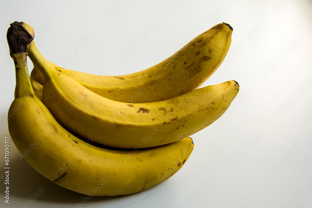 Bunch of ripe yellow bananas on white background Bunch of ripe yellow bananas on white background