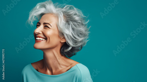 Profile side photo of mature cheerful pretty lady have fun clubber look empty space isolated over turquoise color background