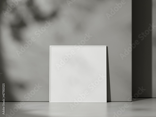 Blank poster with frame mockup on grey wall with shadow