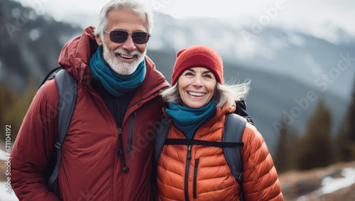 An active happy senior couple enjoying of hiking in the mountains