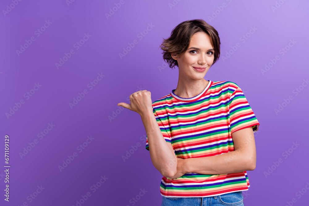 Portrait of charming attractive lady indicating finger empty blank mockup space ad ads advert isolated purple color background Portrait of charming attractive lady indicating finger empty blank mockup space ad ads advert isolated purple color background
