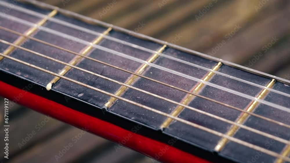 Classical guitar strings and frets close up macro Classical guitar strings and frets close up macro