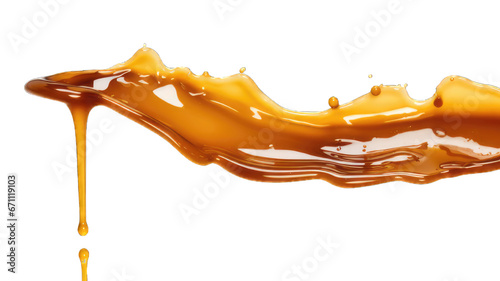 Melted caramel, delicious caramel sauce or maple syrup swirl isolated on white background. photo
