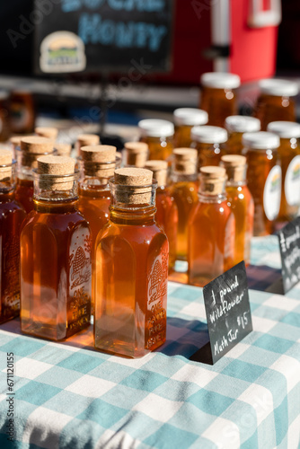 honey bottles with corks at a local farmers market