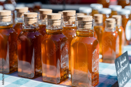 honey bottles with corks at a local farmers market