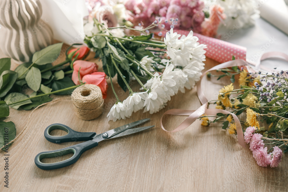 Florist workplace, flowers and scissors