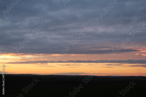 A sunset over a field