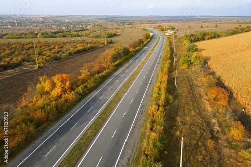 asphalt road. Road seen from the air. Aerial view landscape, dron photography. Autumn highway