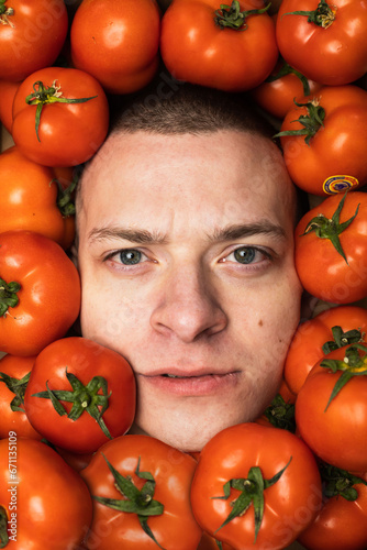 Man's face in tomatoes