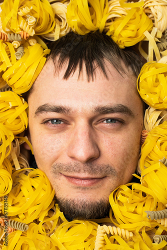 The man's face is covered in yellow paste