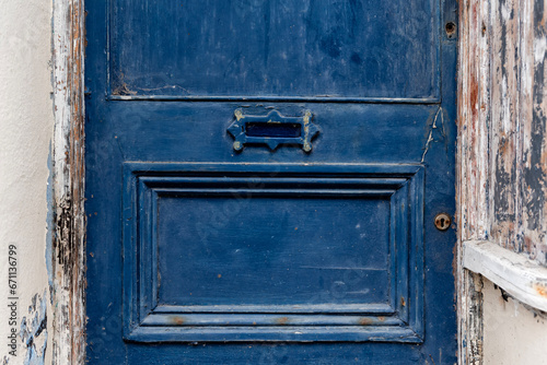 Old blue door with small letterbox