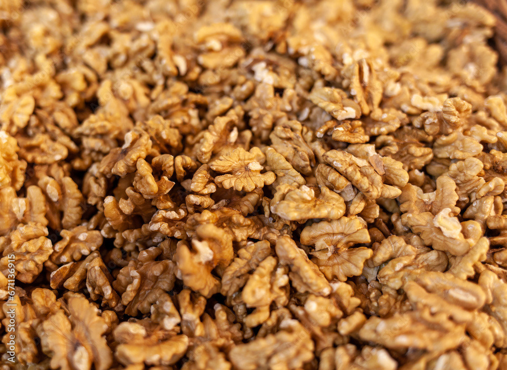 Closeup of Peeled Walnuts Pile. Many Different Textured Walnuts. Walnuts Background. Selling shelled nuts at the market Closeup of Peeled Walnuts Pile. Many Different Textured Walnuts. Walnuts Background. Selling shelled nuts at the market
