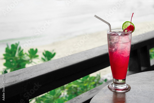 Cocktail on the table and sea in background.