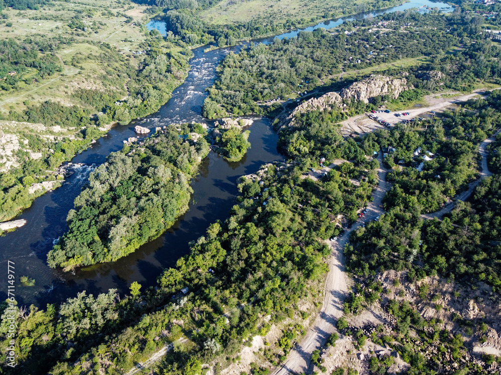 Winding bed of the Southern Bug river. River, landscape from a bird's eye view. Rough, rocky terrain. Winding bed of the Southern Bug river. River, landscape from a bird's eye view. Rough, rocky terrain.