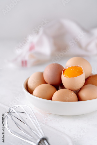 eggs in a bowl on a light background, soft light, close-up