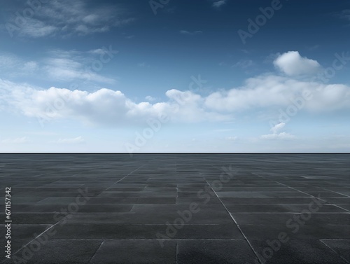 Asphalt dark floor with horizontal blue sky and cloud background