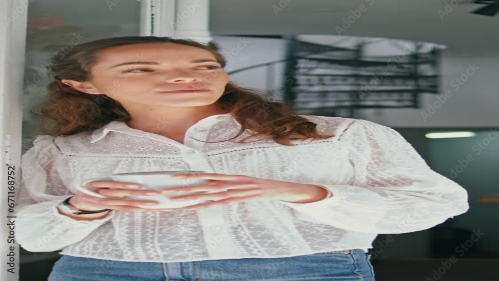 Dreamy woman drink coffee in flower store vertical. Business lady relax in shop. Dreamy woman drink coffee in flower store vertical. Business lady relax in shop.