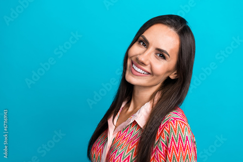 Closeup portrait of charming young lady revealing white perfect toothy smile isolated over teal blue color background