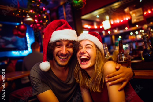 young heterosexual couple having fun and enjoying Christmas at pub or restaurant 