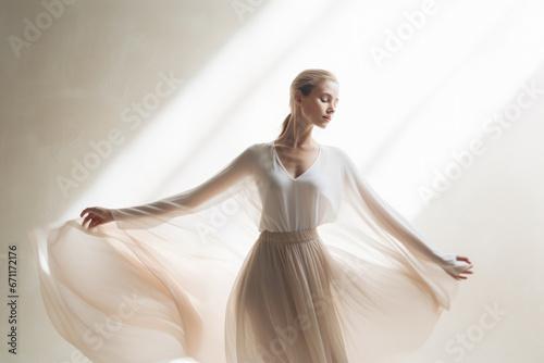 Woman model dancing in a soft minimalist environment