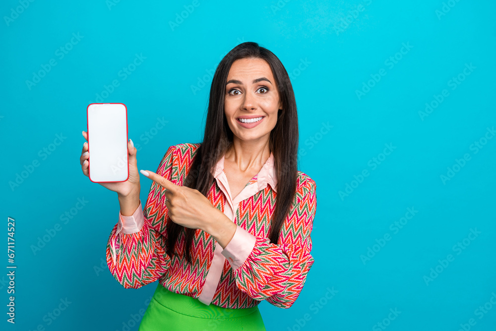 Naklejka premium Photo portrait of pretty young girl hold point telephone display wear trendy print outfit isolated on cyan color background