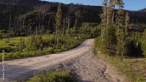 Aerial Footage of Dirt Road in the Mountains at Sunset, Montana, Summertime