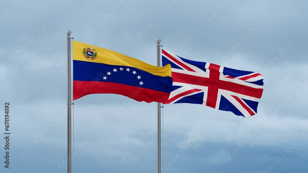 United Kingdom and Venezuela flag waving together on cloudy sky, endless seamless loop, two country cooperation concept United Kingdom and Venezuela flag waving together on cloudy sky, endless seamless loop, two country cooperation concept