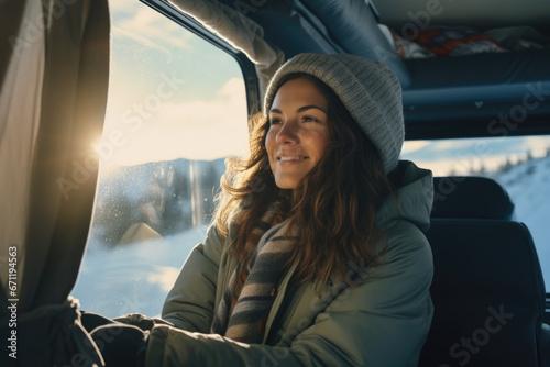 Woman with camper car and winter clothes photo