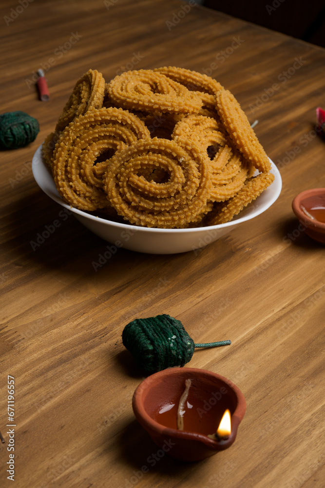 Indian Traditional Tea Time Snack Chakli, a deep fried snack, It is known as Chakali, Murukku, Muruku, Murkoo, Chakri. Indian Traditional Tea Time Snack Chakli, a deep fried snack, It is known as Chakali, Murukku, Muruku, Murkoo, Chakri.