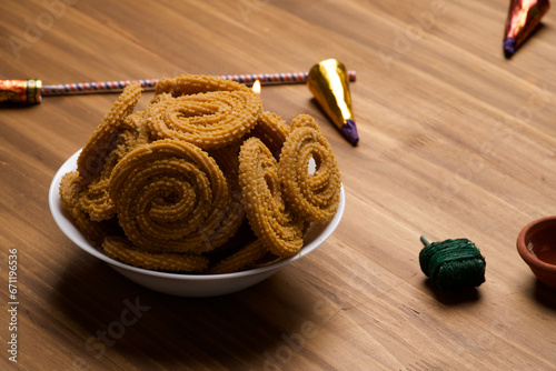 Indian Traditional Tea Time Snack Chakli, a deep fried snack, It is known as Chakali, Murukku, Muruku, Murkoo, Chakri. photo