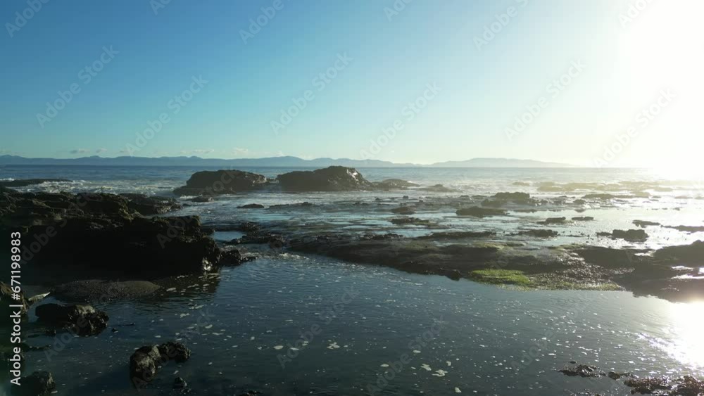 Rocky Shore on the Pacific Ocean Coast. Sunny Sunset. Vancouver Island, BC, Canada. Nature Background Rocky Shore on the Pacific Ocean Coast. Sunny Sunset. Vancouver Island, BC, Canada. Nature Background