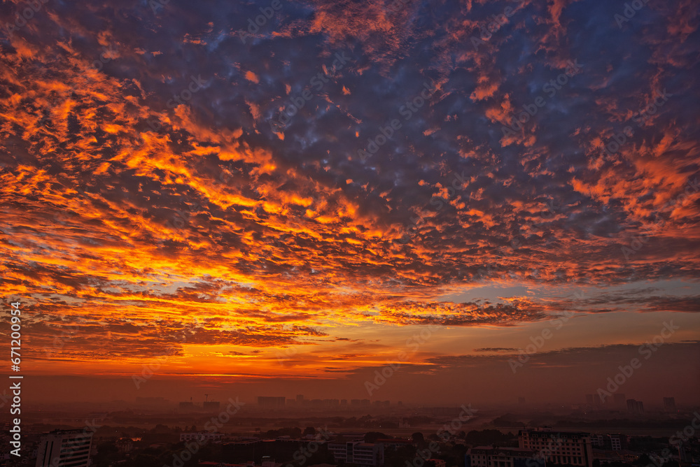 Sunrise over the city with red clouds