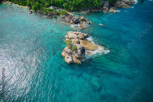 Drone bird eye view at Anse solei beach, turquoise and calm sea and huge granite stones with trees, Mahe Seychelles 3