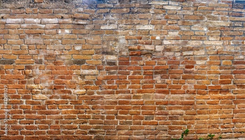 Old wall background with stained aged bricks  full texture  panoramic view