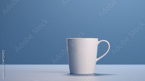 Serene Sip: Cup Mockup Poised on a Soft Blue Background for Subtle Presentation.