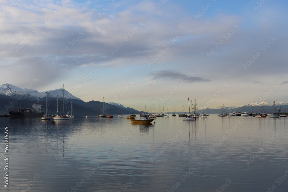 Boats reflecting in the Ushuaia harbour at dawn