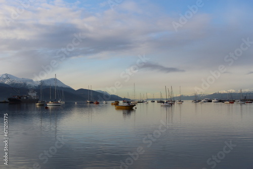 Boats reflecting in the Ushuaia harbour at dawn © Florencia