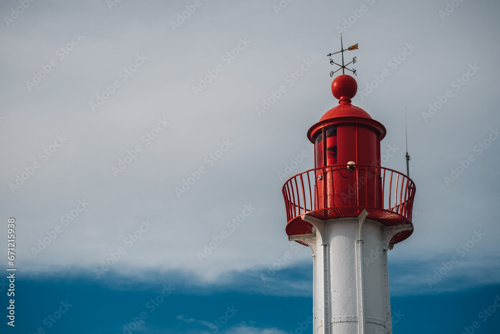 red lighthouse on a sky background