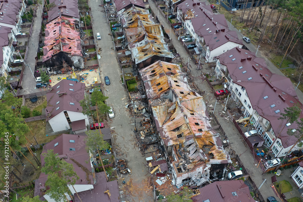 Hostomel, Kyev region Ukraine - 09.04.2022: Top view of the destroyed and burnt houses. Houses were destroyed by rockets or mines from Russian soldiers. Cities of Ukraine after the Russian occupation. Hostomel, Kyev region Ukraine - 09.04.2022: Top view of the destroyed and burnt houses. Houses were destroyed by rockets or mines from Russian soldiers. Cities of Ukraine after the Russian occupation.