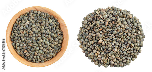 raw french green lentils in wooden bowl isolated on white background. Top view. Flat lay photo