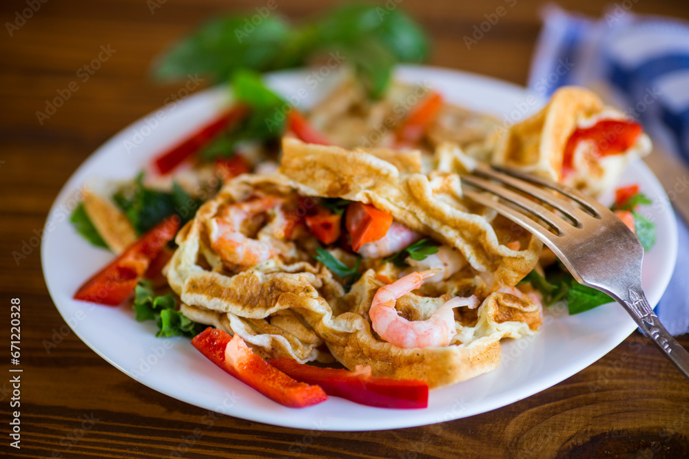 Fried simple omelet with shrimp and vegetables in a plate. Fried simple omelet with shrimp and vegetables in a plate.