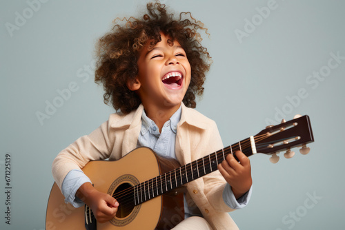 Vibrant Studio Scene: Child Playing Guitar Happily