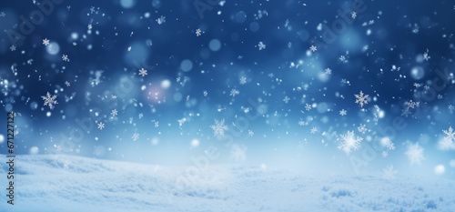 Falling snowflakes and Bokeh with white snow on a blue background.