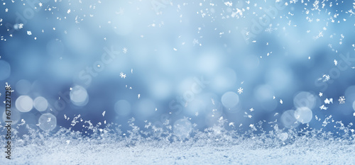 Falling snowflakes and Bokeh with white snow on a blue background. © uv_group