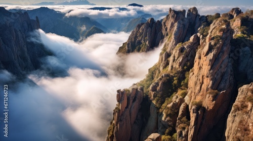  a view of the top of a mountain with low lying clouds in the foreground and mountains in the background.  generative ai