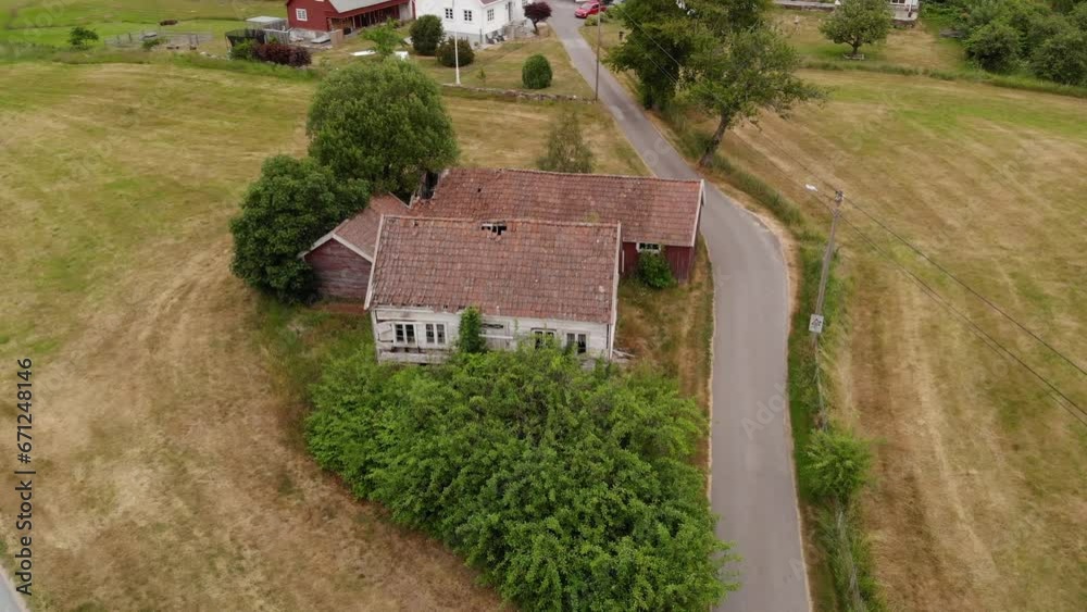 Drone view of an abandoned farm house and barn Drone view of an abandoned farm house and barn