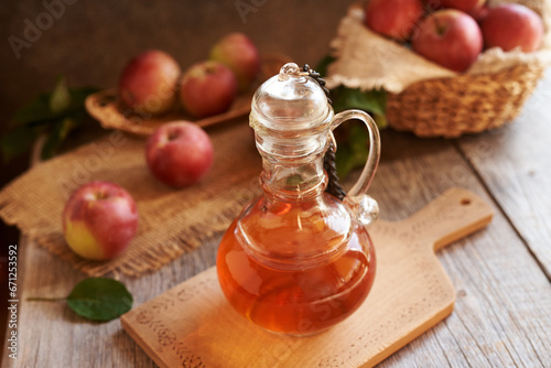 Apple cider vinegar in a glass bottle on a table