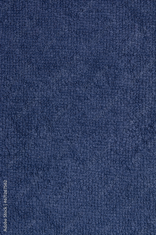 Dark blue terry cloth. The texture is blue fabric. Background terry fabric blue Dark blue terry cloth. The texture is blue fabric. Background terry fabric blue